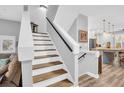 Modern staircase with white risers and wooden treads at 1373 Curlew Rd, Dunedin, FL 34698