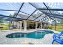 Relaxing kidney-shaped pool with a covered patio and seating area at 807 Belle Timbre Ave, Brandon, FL 33511