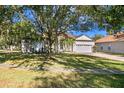 Property exterior, showcasing a well-maintained lawn and driveway at 16310 Ashington Park Dr, Tampa, FL 33647