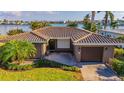 Single-story home with tile roof, large yard and water views at 16323 Redington Dr, Redington Beach, FL 33708