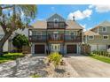Two-story house with a light blue exterior and double-car garage at 394 Ulelah Ave, Palm Harbor, FL 34683