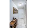 Bright condo entryway with tile floors and storage at 4580 Overlook Ne Dr # 297, St Petersburg, FL 33703