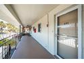 Condominium hallway with white walls and balcony at 4580 Overlook Ne Dr # 297, St Petersburg, FL 33703