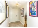 Bright and airy entryway with updated flooring and artwork at 736 Island Way # 606, Clearwater Beach, FL 33767