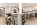 Modern kitchen with stainless steel appliances and a large island at 736 Island Way # 606, Clearwater Beach, FL 33767