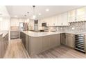 U-shaped kitchen with quartz countertops and custom cabinetry at 736 Island Way # 606, Clearwater Beach, FL 33767