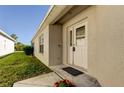 Front entrance with a white door and decorative glass at 3152 Banyan Hill Ln, Land O Lakes, FL 34639