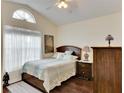 Bedroom with a wood-look floor and ceiling fan at 31935 Brookstone Dr, Wesley Chapel, FL 33545