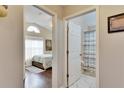 Hallway with doors leading to a bedroom and bathroom at 31935 Brookstone Dr, Wesley Chapel, FL 33545