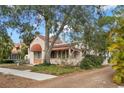 Side view of Spanish style home showcasing unique architecture at 2311 Brevard Ne Rd, St Petersburg, FL 33704