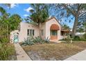 Front view of charming Spanish style home with gated entry at 2311 Brevard Ne Rd, St Petersburg, FL 33704