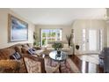 Bright living room featuring hardwood floors, comfy sofas, and a coffee table at 22247 Red Jacket Ln, Land O Lakes, FL 34639