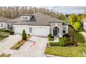 Attractive two-story home with a two-car garage and landscaped front yard at 4155 Barletta Ct, Wesley Chapel, FL 33543
