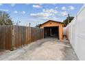 Single car garage with wooden walls and a concrete floor at 440 77Th Ave, St Pete Beach, FL 33706