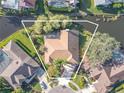 Aerial view showcasing the home's location and canal-side setting at 1000 Chillum Ct, Safety Harbor, FL 34695