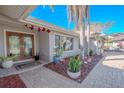 Inviting front entry with double doors, landscaping, and a brick walkway at 1000 Chillum Ct, Safety Harbor, FL 34695