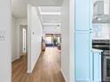 View down a hallway into a living area and kitchen at 2064 Sunset Point Rd # 72, Clearwater, FL 33765