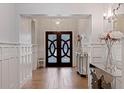 Elegant entryway with double doors and a stylish console table at 2790 Pinellas Point S Dr, St Petersburg, FL 33712