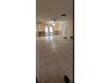 Bright living room with tile floors and access to patio at 515 Cottage Ln, Brandon, FL 33510