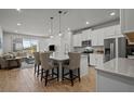 Open concept kitchen with island and breakfast bar at 2391 Summerlit St, Lutz, FL 33558
