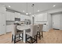 Modern kitchen with island and stainless steel appliances at 2391 Summerlit St, Lutz, FL 33558