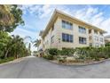 Building exterior showcasing architectural details and landscaping at 3806 Gulf Of Mexico Dr # C211, Longboat Key, FL 34228