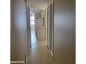Hallway with view into kitchen and other rooms at 122 Loblolly Ct # H, Oldsmar, FL 34677