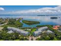 Community overview featuring waterfront access and pool at 1355 Pinellas Bayway S # 23, Tierra Verde, FL 33715