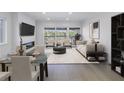 Open concept living space with fireplace and access to balcony at 1355 Pinellas Bayway S # 23, Tierra Verde, FL 33715