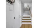 Bright and airy entryway with modern staircase at 1355 Pinellas Bayway S # 23, Tierra Verde, FL 33715