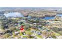 Stunning aerial view of a lakeside community showcasing beautiful houses and mature trees in a desirable location at 22368 Southshore Dr, Land O Lakes, FL 34639