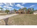 Two story home featuring an attached garage and long driveway at 2359 Gimlet Ave, Spring Hill, FL 34608