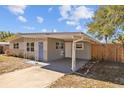 Ranch home with a covered carport and updated facade at 4923 Azalea Dr, New Port Richey, FL 34652
