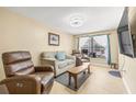 Cozy living room with leather recliners and a wood coffee table at 1010 59Th N Ave, St Petersburg, FL 33703