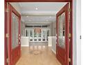 Open entryway with double red doors leading into the living area at 10106 Radcliffe Dr, Tampa, FL 33626