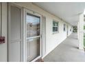 Exterior view of building showing walkway and condo entrance at 19029 Us Highway 19 N # 5-1, Clearwater, FL 33764