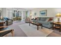 Bright living room featuring comfortable seating and view to patio at 19029 Us Highway 19 N # 5-1, Clearwater, FL 33764