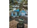 Charming blue single-Gathering home with a well-maintained lawn, swing and a one-car garage at 5524 Kentucky Ave, New Port Richey, FL 34652