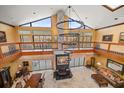 High-ceiling great room with a fireplace and balcony at 18409 Tyler Rd, Odessa, FL 33556