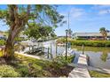 Peaceful waterfront view with boats docked along the canal at 9386 Tradewinds Ave, Seminole, FL 33776