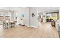 Light and airy dining room with hardwood floors and view into Gathering room at 14672 Horse Trot Rd, Lithia, FL 33547