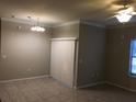 Bright living room with tile floors and neutral walls at 2171 Portofino Pl # 27-2717, Palm Harbor, FL 34683