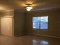 Bright living room with tile floors and neutral walls at 2171 Portofino Pl # 27-2717, Palm Harbor, FL 34683