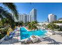 Expansive pool area with lounge chairs and tropical landscaping at 100 1St N Ave # 1601, St Petersburg, FL 33701