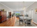 Elegant dining room with hardwood floors and modern light fixture at 12055 Gandy N Blvd # 243, St Petersburg, FL 33702