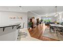 Open concept living area with hardwood floors and access to balcony at 12055 Gandy N Blvd # 243, St Petersburg, FL 33702
