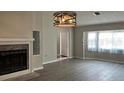 Bright living room featuring a fireplace and laminate wood floors at 1311 4Th W St, Palmetto, FL 34221