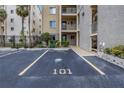 Designated parking spot for unit 101 with building in view at 3500 Lake Bayshore Dr # K-101, Bradenton, FL 34205