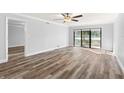 Bright living room with vinyl flooring and sliding glass doors at 3505 Tarpon Woods Blvd # K403, Palm Harbor, FL 34685