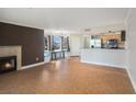 Spacious living room with fireplace and tile floors at 2400 Feather Sound Dr # 418, Clearwater, FL 33762